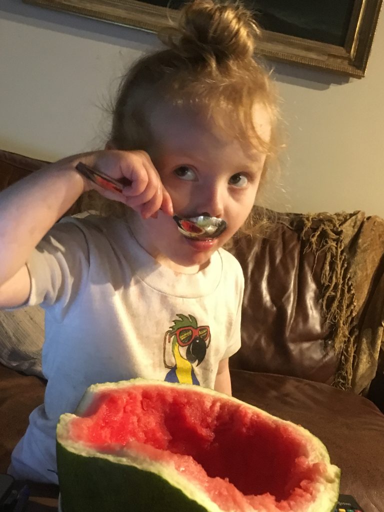 Riley eating watermelon